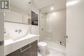 Toronto (Waterfront Communities) condo for rent - A white bathroom with a toilet, sink, and shower.