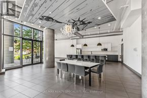 Toronto (Niagara) condo for rent - A modern dining room with a large table and chairs.