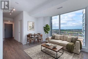 Markham (Greensborough) condo for rent - A living room with a couch, a coffee table, and a dining table with chairs.