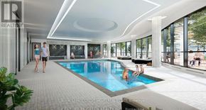 Mississauga (Hurontario) condo for rent - A large indoor swimming pool with people in it.