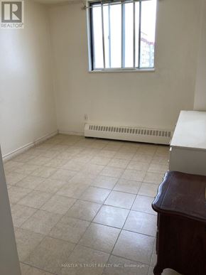 Toronto (Yorkdale-Glen Park) condo for rent - A room with a window and a radiator on the wall.