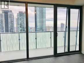 Toronto (Waterfront Communities) condo for rent - A balcony with a view of the cityscape.
