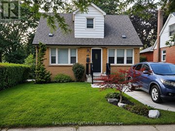 Toronto (Clairlea-Birchmount) apartment for rent - A living room with a white couch and a painting on the wall.
