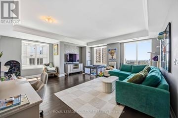 Toronto (Bay Street Corridor) condo for rent - A living room with a green couch and a white coffee table.