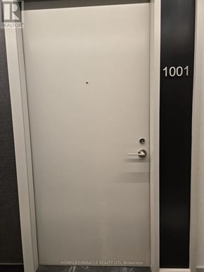 Toronto (Waterfront Communities) condo for rent - A white door with the number 1001 on the side.