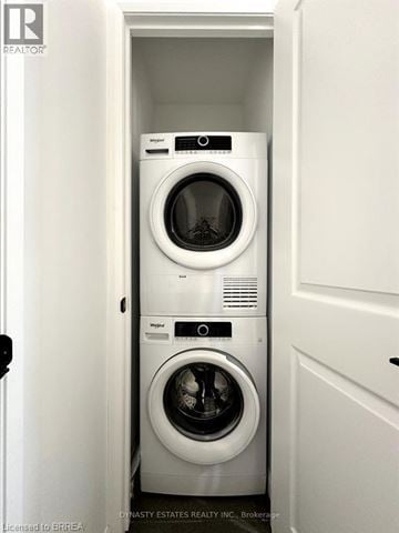 Brantford condo for rent - A white washer and dryer in a small laundry room.