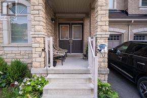 Milton (Fo Ford) townhouse for rent - A black car is parked in front of a house with a sign that says "For Sale".
