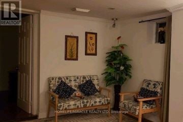Toronto (Wexford-Maryvale) apartment for rent - A living room with a couch and two chairs.