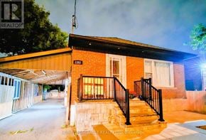 Toronto (Wexford-Maryvale) apartment for rent - A house with a realtor sign in front of it.