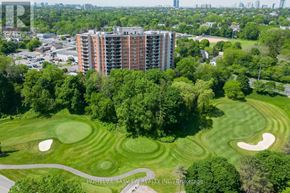 Markham (Thornhill) condo for rent - A golf course with a large building in the background.