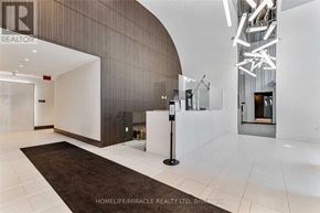 Toronto (York University Heights) condo for rent - A hallway with a sign that says "REALTOR" on the wall.