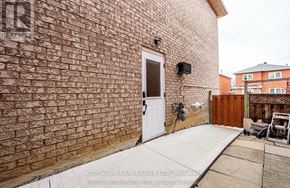 Mississauga (Hurontario) apartment for rent - A brick wall with a white door and a small window above it.