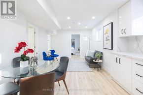 Mississauga (Rathwood) apartment for rent - A modern dining room with a glass table and chairs.