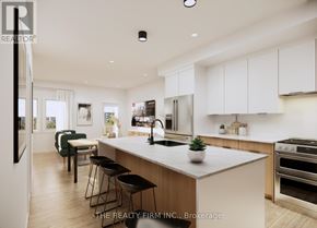London South (South U) townhouse for rent - A modern kitchen with a large island and stainless steel appliances.