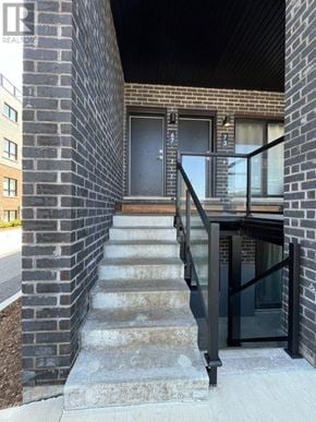 Niagara Falls (Morrison) townhouse for rent - A black door is on the brick building.