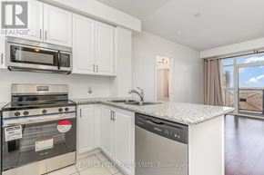 Toronto (Banbury-Don Mills) condo for rent - A tall building with a gazebo in front of it.