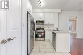 Toronto (Banbury-Don Mills) condo for rent - A hallway with a glass door leading to a dining area.
