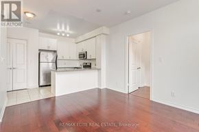 Toronto (Banbury-Don Mills) condo for rent - A spacious, well-lit lobby with marble flooring and a curved staircase.