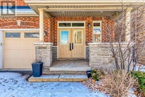Oakville (Jc Joshua Creek) apartment for rent - A house with a brown door and a brown garage door.