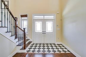 Oakville (Jc Joshua Creek) apartment for rent - A white door with a black and white checkered floor.