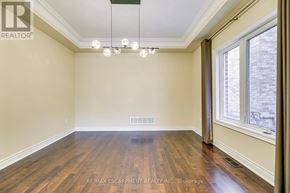 Oakville (Jc Joshua Creek) apartment for rent - A room with wooden floors and a chandelier.