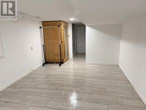 Markham (Unionville) apartment for rent - A room with a wooden cabinet and a grey floor.