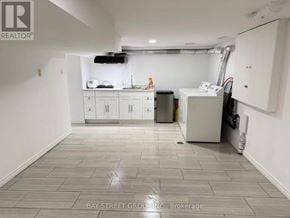 Markham (Unionville) apartment for rent - A clean, empty room with white cabinets and a tiled floor.