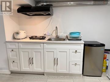 Markham (Unionville) apartment for rent - A kitchen with white cabinets and a stainless steel dishwasher.
