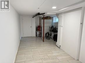 Markham (Unionville) apartment for rent - A room with a white door and a white wall with a logo on it.