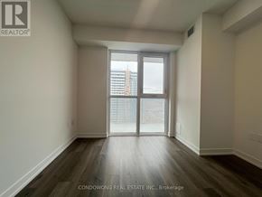 Vaughan (Concord) condo for rent - A room with a sliding glass door leading to a balcony.