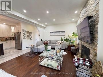 Milton (Sc Scott) apartment for rent - A living room with a glass coffee table and a fireplace.