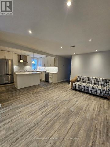 Toronto (Clairlea-Birchmount) apartment for rent - A realtor's office with a couch and a kitchenette.