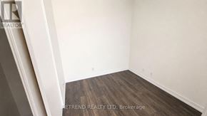 Vaughan (Vaughan Corporate Centre) condo for rent - A room with wooden flooring and white walls.