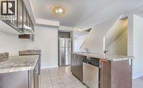 Cambridge townhouse for rent - A kitchen with granite countertops and stainless steel appliances.