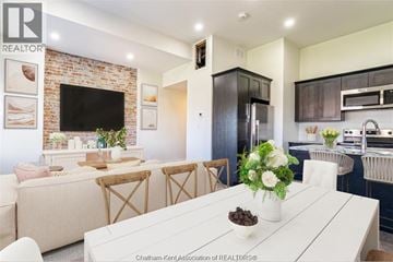 Chatham apartment for rent - A modern kitchen with a white dining table set in the middle.