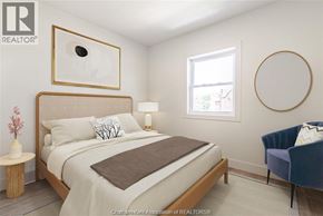 Chatham apartment for rent - A bedroom with a bed, a chair, and a painting on the wall.
