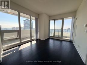 Toronto (Mount Pleasant West) condo for rent - A spacious room with large windows and a view of the city.