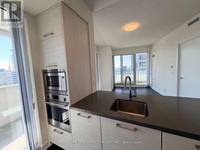 Toronto (Mount Pleasant West) condo for rent - A modern kitchen with a sink and a stove top oven.