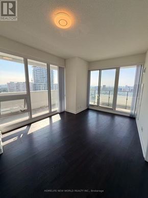 Toronto (Mount Pleasant West) condo for rent - A room with a view of the city through large windows.