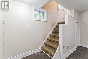 Burlington (Mountainside) apartment for rent - A staircase with a beige carpeted runner and white walls.