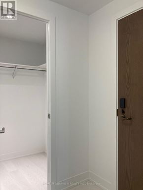 Toronto (Banbury-Don Mills) condo for rent - A white wall with a door and a small closet with a shelf.