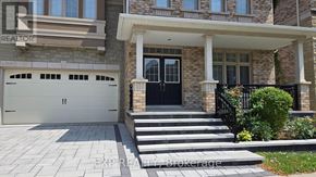 Oakville (Wt West Oak Trails) apartment for rent - A house with a black front door and a stone pillar.