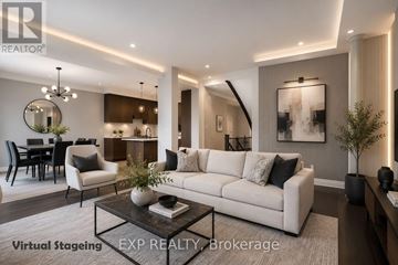 Oakville (Wt West Oak Trails) apartment for rent - A modern living room with a white sofa, a coffee table, and a dining table with chairs.