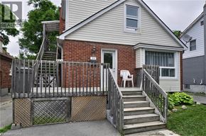 Cambridge apartment for rent - A house with a red brick exterior and a white door.