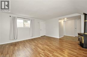 Cambridge apartment for rent - A room with wooden flooring and a fireplace.