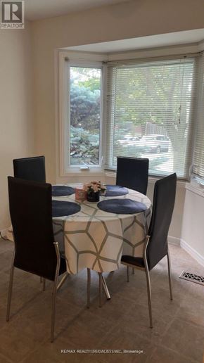 Brantford townhouse for rent - A dining room with a table set for two.