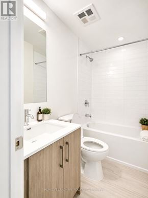Toronto (Humber Heights) condo for rent - A white bathroom with a toilet, sink, and bathtub.