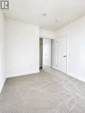 Toronto (Humber Heights) condo for rent - A room with a carpeted floor and white walls.