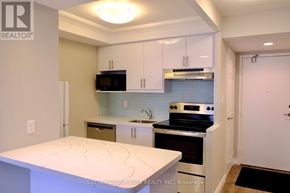 Toronto (Bay Street Corridor) condo for rent - A kitchen with a white counter top and a stove top oven.