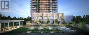 Toronto (Bayview Village) condo for rent - A modern apartment building with a well-manicured lawn in front.